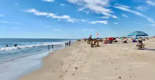 Blue sky over the beach at Delaware Seashore State Park, one of the best things to do in Rehoboth Beach Delaware